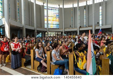 CRACOW POLAND - JULY 26 2016: World Youth Day 2016 - Crowd of Pilgrims inside of the Sanctuary of Divine Mercy in Lagiewniki. Cracow Poland