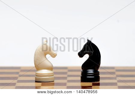 Chess pieces on the Board on a white background