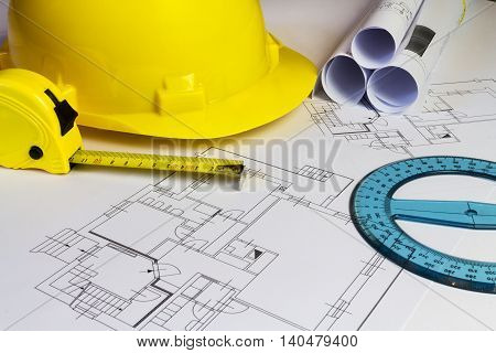 An office desk with the project papers