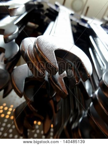 Upper view of open ended wrenches on the showcase of hardware shop