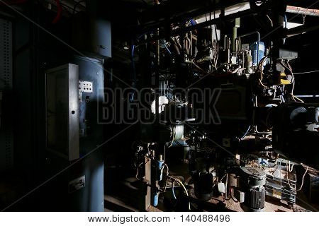 Old Factory Machinery In A Dark Room With Less Light