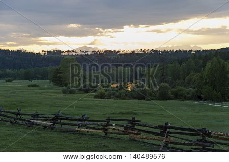 Summer meadow at sunset. Tunkinskaya valley, foothills of Sayan, Buryatia