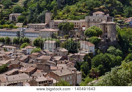 Roofs of houses and medieval castle in Largentiere France