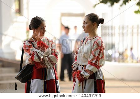 Orel Russia - July 28 2016: Russia baptism anniversary Divine Liturgy. Two girls in traditional Russian clothes horizontal