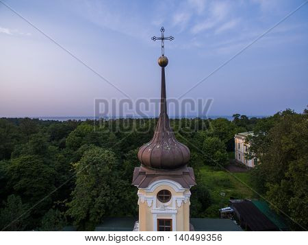 Old church on the forest background in Rissia