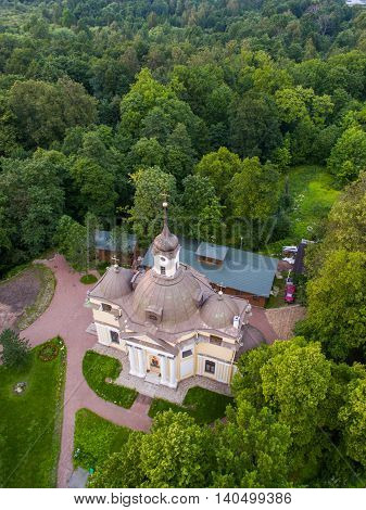 Old church on the forest background in Rissia