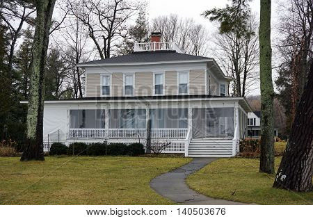 WEQUETONSING, MICHIGAN / UNITED STATES - DECEMBER 22, 2015: A large home on Beach Drive in Wequetonsing, Michigan.