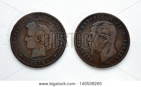Detailed view of the old copper coin on the white backing