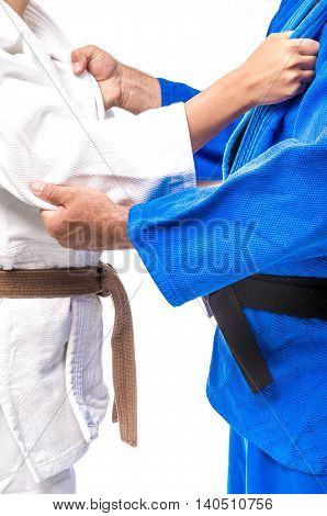 Judo Gripping between female judo brown belt and her sensei black belt isolated on white background
