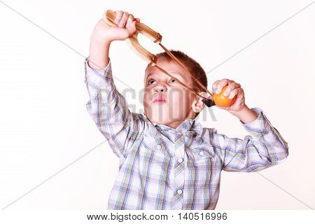 Young Boy Use Sling Shot Shoot Mandarine.