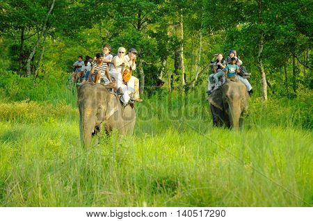 Chitwan,np-circa August 2012 - Tourists Doing Safari On Elephants Back, Circa August 2012 At Chitwan