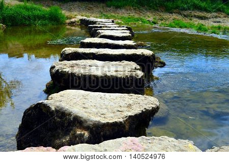 closeup of stepstones crossing a small river