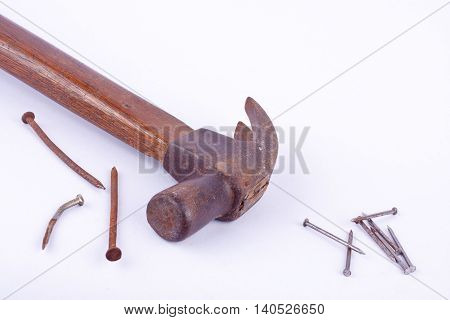 old Traditional curved claw hammer and rust nail tack used on white background tool isolated