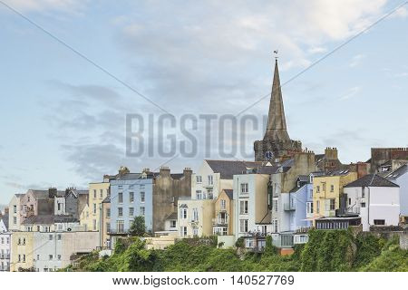 An image of the beautiful pastel colored buildings overlooking Tenby Harbour Tenby South Wales UK