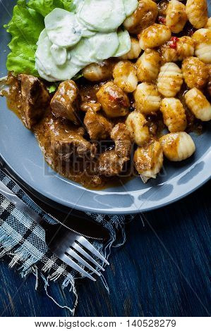 Italian Potato Dumplings With Stew And Cucumber Salad
