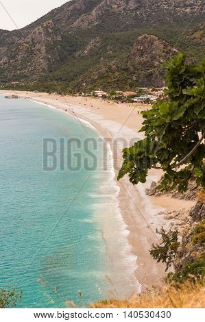 blue sea water and uncrowded beach of Oludeniz in Turkey