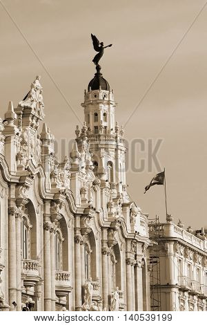 Gran Teatro in Havana Cuba with the fascade view and national cuba flag - sepia
