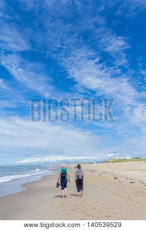 Kijkduin the Netherlands - July 13 2016: senior couple walking on the beach