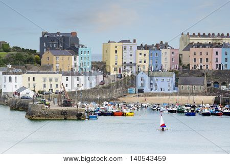 An image of the beautiful pastel colored buildings overlooking Tenby Harbour Tenby South Wales UK