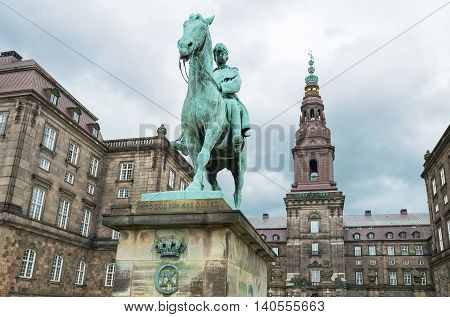 Copenhagen upward view of the Chrisrianborg palace with the monument of King Cristian IX in the foreground