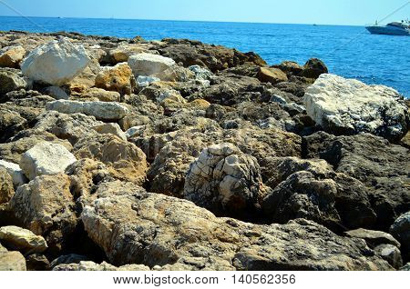 rocky coast at french riviera with azure blue water