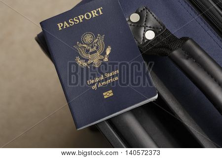 a passport sitting on top of a suitcase
