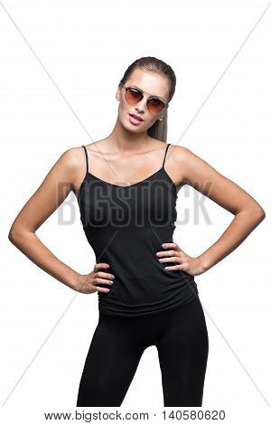 Portrait of the young sexual sporty blonde wearing sunglasses. Isolated on White. Black shirt , tight leggins.