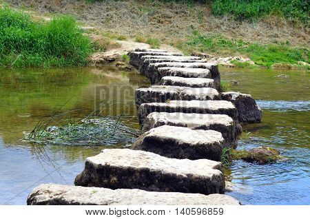 closeup of stepstones crossing a small river