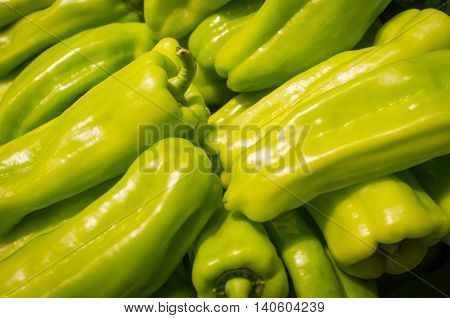 Spicy organic cubanelle chili peppers on display at local farmers market