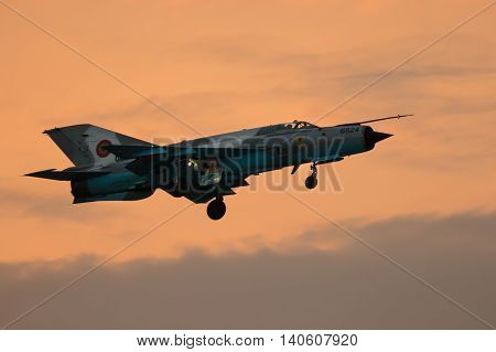 BUCURESTI (Romania) - JUNE 30: MIG 21 LANCER fighter plane performs a demonstration flight on the Bucharest International Air Show