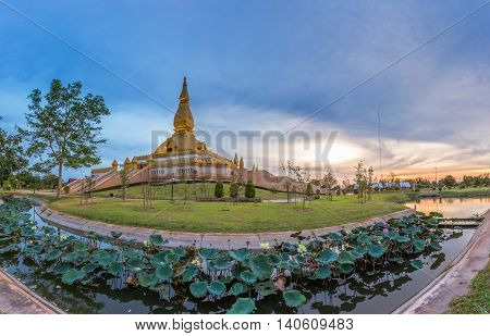 Famous Maha Mongkol Bua Pagoda In Roi-ed Thailand At Sunset.