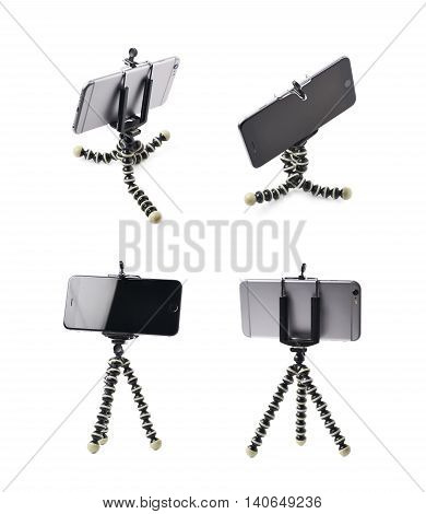 Smartphone set up on a tripod isolated over the white background, set of four different foreshortenings