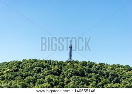 Petrin Tower Prague from a distance. Looks like the forest has overgrown the eiffel tower.