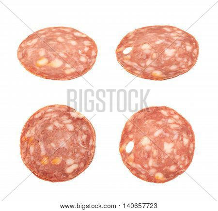Single slice of Italian sausage salame napoli, composition isolated over the white background, set of four different foreshortenings