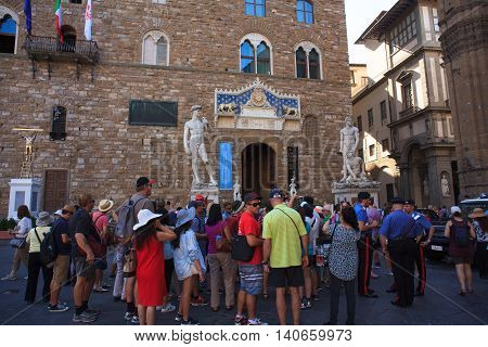 FLORENCE ITALY - JULY 12: Tourists in the Signoria square on July 12 2016
