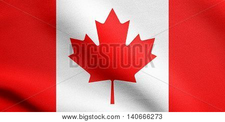 Flag of Canada waving in the wind with detailed fabric texture. Canadian national flag.