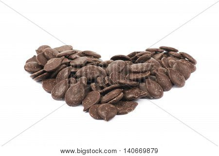 Heart shape made of cooking chocolate teardrop shaped chips, composition isolated over the white background