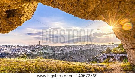 View Through Cave Of Sassi Di Matera,basilicata, Italy, Unesco Under Blue Sky And Sun Flare