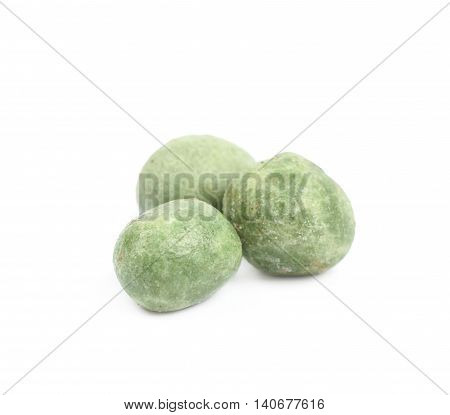 Green wasabi coated peanuts isolated over the white background