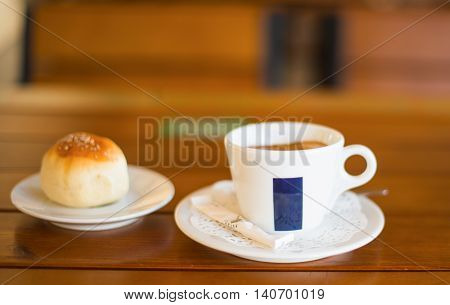 Coffee Cup and Bread Roll. Continental Breakfast.