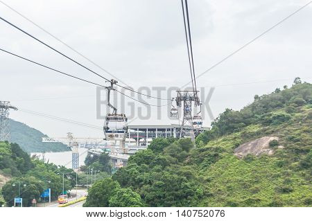 HONG KONG - MAY 26: The Ngong Ping 360 cable cars carry tourists to Ngong Ping village in the cloudy day on May 26 2016 in Hong Kong.