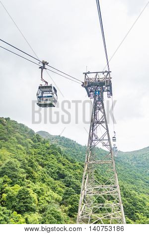 HONG KONG - MAY 26: The Ngong Ping 360 cable cars carry tourists to Ngong Ping village in the cloudy day on May 26 2016 in Hong Kong.