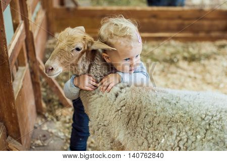 Girl Hugging Lamb