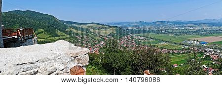 Panoramic and aerial view of one part at the city of Deva Romania from the ruins of a citadel built in 1250 and located at an altitude of 371 meters above the city.