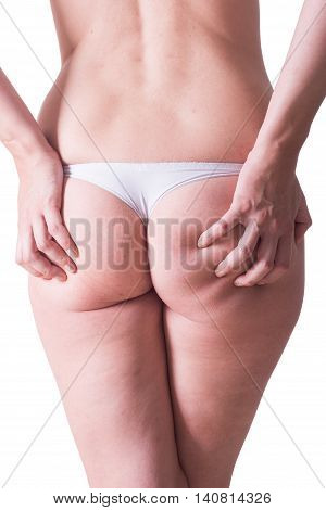 Woman in white panties with cellulite on her butt. isolated on white background with clipping path included