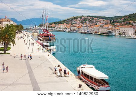 TROGIR CROATIA - JUNE 19 2014: The Old Town of Trogir at the pier and promenade Croatia. UNESCO World heritage site. Trogir is a popular tourist destination near to Split city.