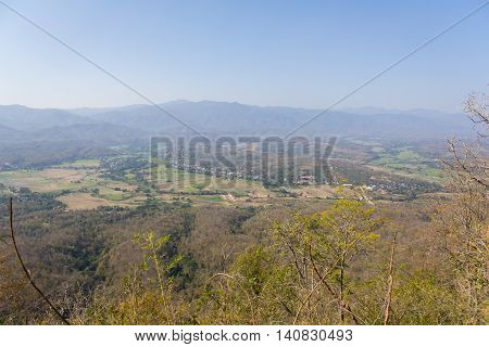 The village is in a valley landscape in Thailand.
