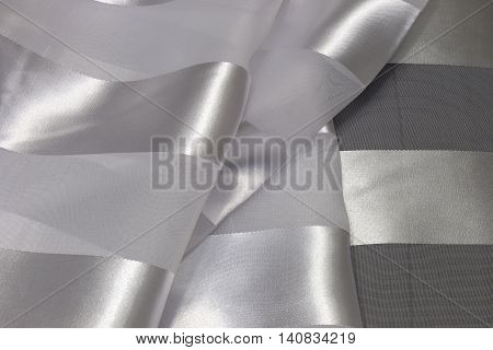 This is a photograph of striped White Polyester fabric scarf with sheer insert