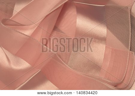 This is a photograph of Pink striped Polyester fabric scarf with sheer insert