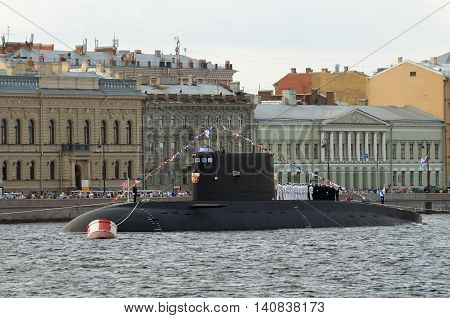 Submarine at anchor.Boat crew lined up on deck.